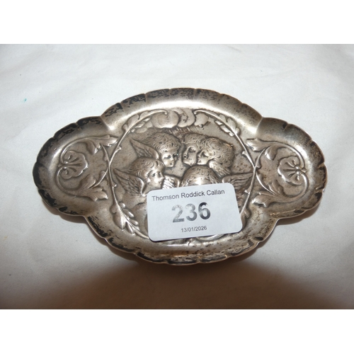 236 - Late Victorian silver shaped pin dish, embossed with cherubs.