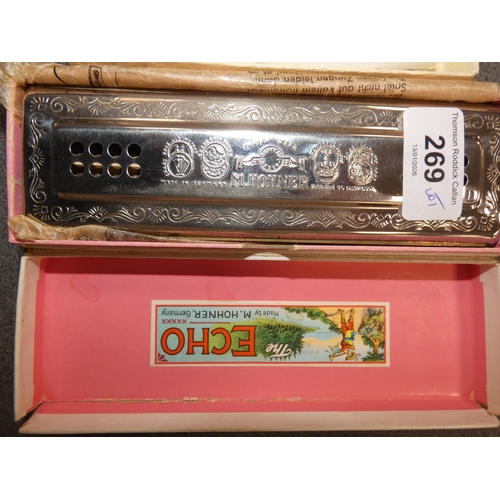 269 - Two Hohner 'The Echo Harp' harmonicas, in fitted boxes, and a boxed sterling silver propelling penci... 