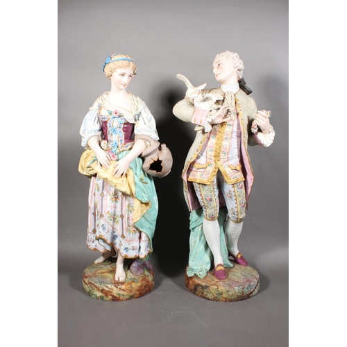 211 - Large pair of 19th century porcelain figures, the male modelled holding a pair of doves, the female ... 