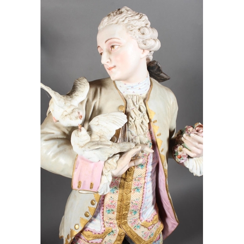 211 - Large pair of 19th century porcelain figures, the male modelled holding a pair of doves, the female ... 