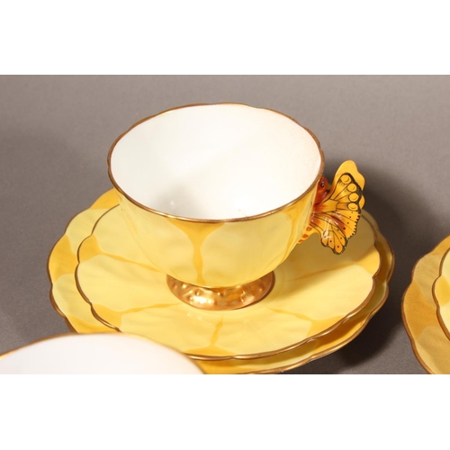 204 - Aynsley B1791 floral pattern forty piece part tea set with butterfly handles. (40)