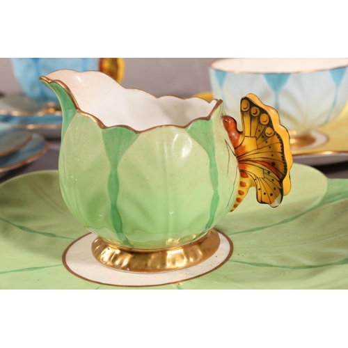 204 - Aynsley B1791 floral pattern forty piece part tea set with butterfly handles. (40)
