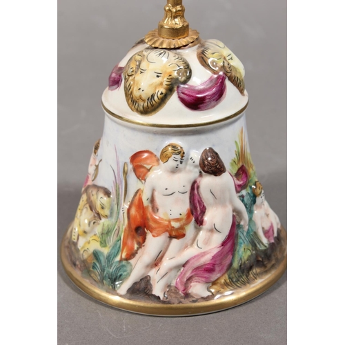203 - Italian Capodimonte table bell decorated in relief with chariot scene, gilded brass handle, 31cm tal... 