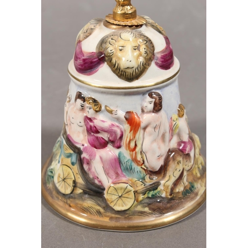203 - Italian Capodimonte table bell decorated in relief with chariot scene, gilded brass handle, 31cm tal... 