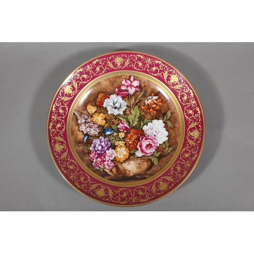 209 - Kaiser of West Germany, a large porcelain charger dish with central bowl of flowers vignette after C... 