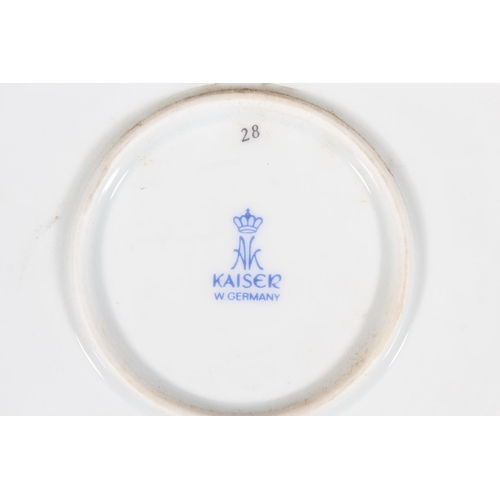 209 - Kaiser of West Germany, a large porcelain charger dish with central bowl of flowers vignette after C... 