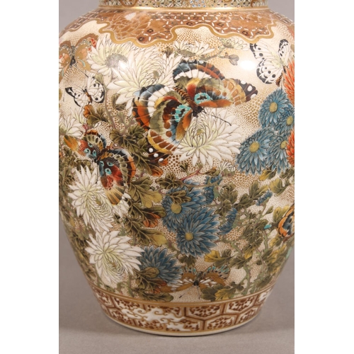 210 - Japanese Satsuma baluster jar and cover, the body decorated with butterflies and chrysanthemums, six... 