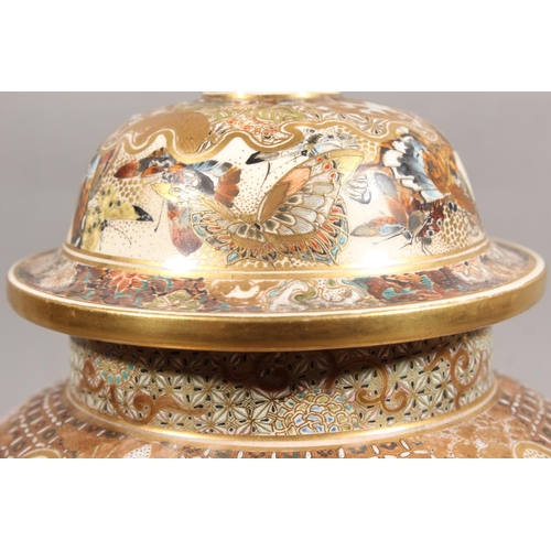 210 - Japanese Satsuma baluster jar and cover, the body decorated with butterflies and chrysanthemums, six... 