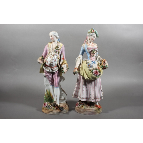 212 - Pair of 19th century porcelain figures of a lady and gentleman holding flowers, the male inscribed '... 