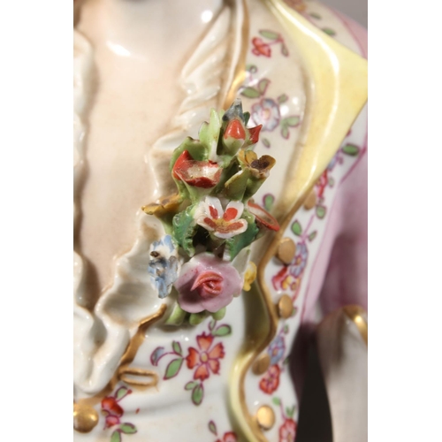 212 - Pair of 19th century porcelain figures of a lady and gentleman holding flowers, the male inscribed '... 