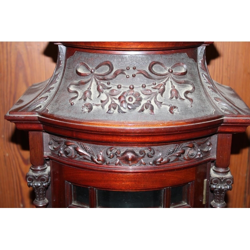 462 - Antique style mahogany wall cabinet having swan neck pediment above relief ribbon and floral frieze,... 