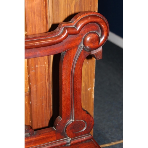 463 - Late Victorian carved mahogany bench, the back with family crest shield plaque depicting a hand clut... 