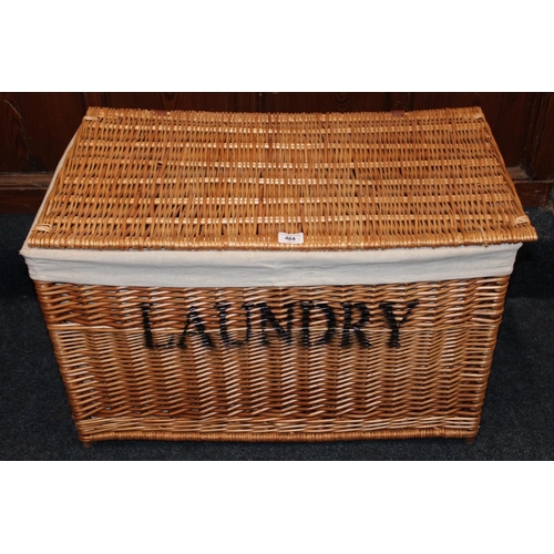 464 - Wicker laundry basket with twin division interior, 77cm long.&nbsp;