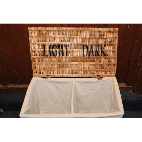464 - Wicker laundry basket with twin division interior, 77cm long.&nbsp;