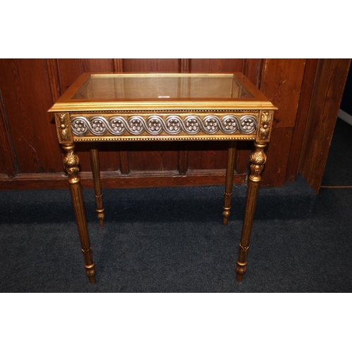 465 - Modern gold and silver effect hinge top bijouterie table, raised on turned and fluted supports termi... 