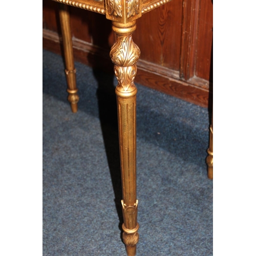 465 - Modern gold and silver effect hinge top bijouterie table, raised on turned and fluted supports termi... 