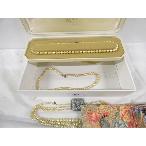 109 - Small box of faux pearls and costume jewellery.