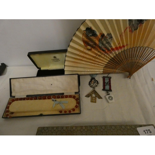 175 - Two masonic jewels and Art Deco bead necklace and cat fan.