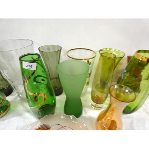 216 - Large collection of art glass vases and bowls.