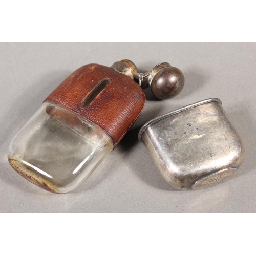 10 - Two sgian dubhs, a silver-plated and leather hip flask and a Scottish silver-plated belt plate.