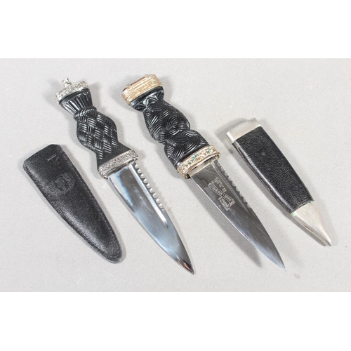 10 - Two sgian dubhs, a silver-plated and leather hip flask and a Scottish silver-plated belt plate.