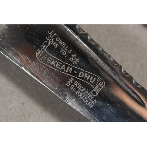 10 - Two sgian dubhs, a silver-plated and leather hip flask and a Scottish silver-plated belt plate.