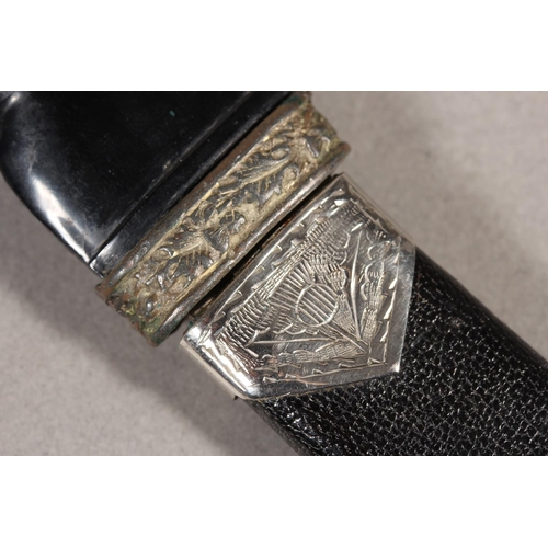 10 - Two sgian dubhs, a silver-plated and leather hip flask and a Scottish silver-plated belt plate.