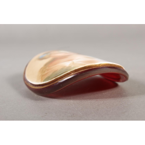 7 - Glass roundel depicting a Victorian figure with head dress, 11cm.