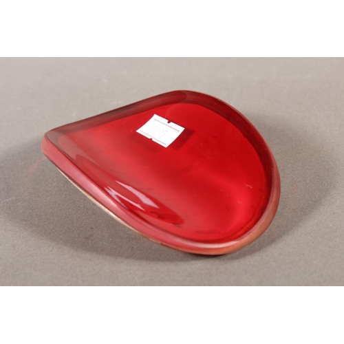 7 - Glass roundel depicting a Victorian figure with head dress, 11cm.