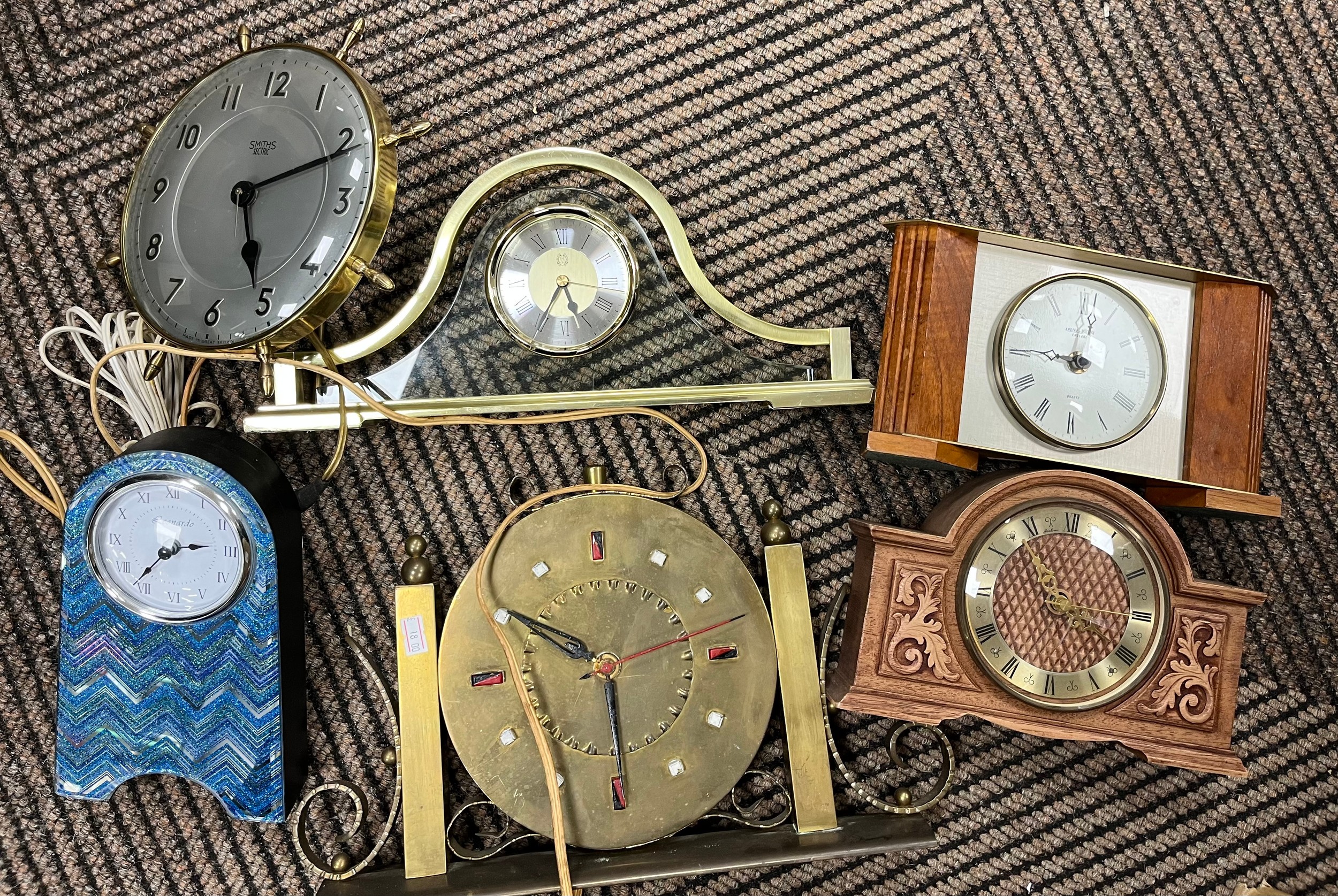 Collection of decorative wall and desk clocks.