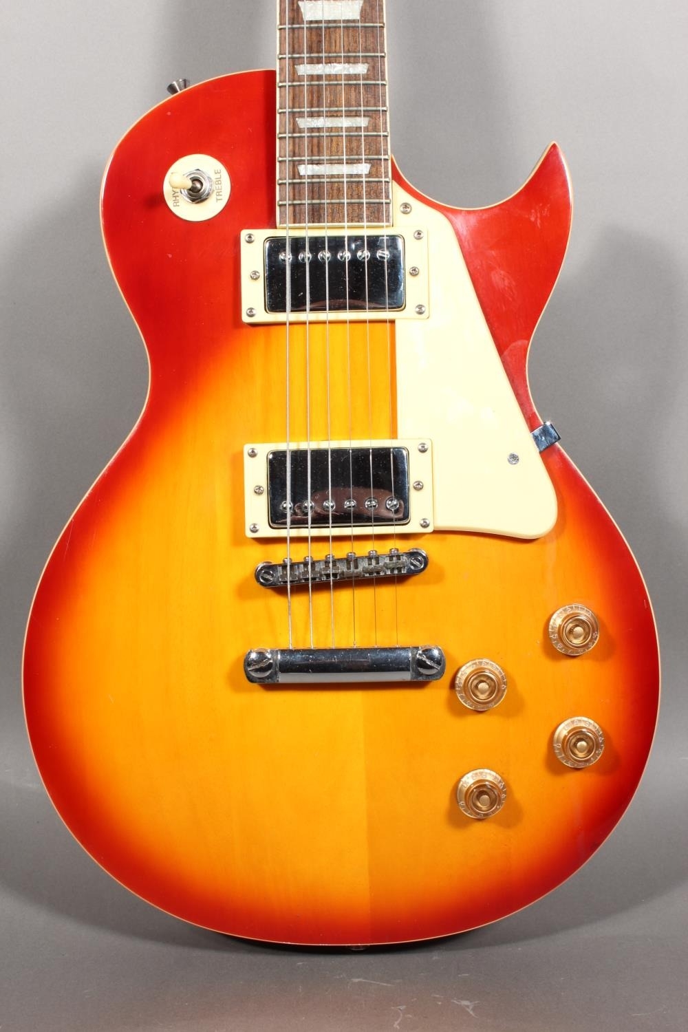 Rockburn Les Paul style six string electric guitar with sunburst finish.