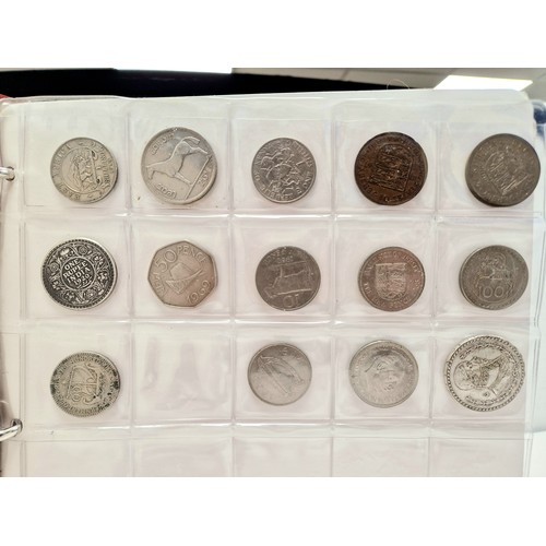 Collectors folder containing eleven sheets of world coins