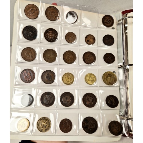 Collectors folder containing eleven sheets of world coins