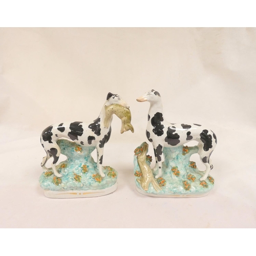 84 - Pair of Victorian Staffordshire pottery black and white Disraeli greyhound figures, one with a hare ... 