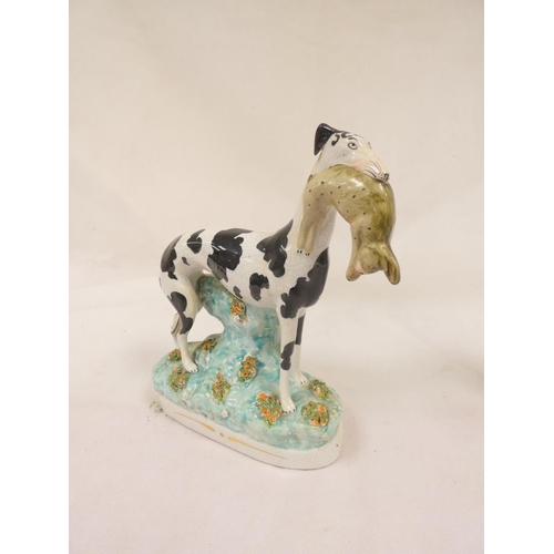 84 - Pair of Victorian Staffordshire pottery black and white Disraeli greyhound figures, one with a hare ... 