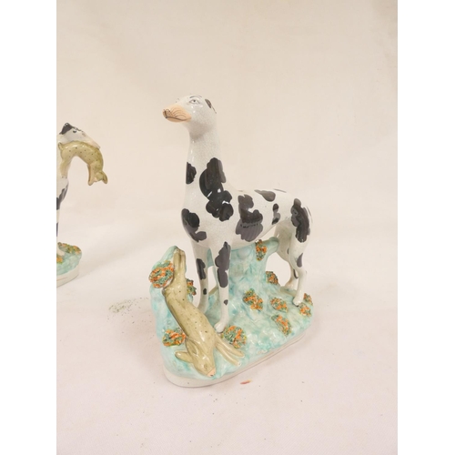 84 - Pair of Victorian Staffordshire pottery black and white Disraeli greyhound figures, one with a hare ... 