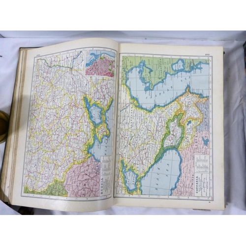 324 - Two large atlases to include new atlas of the world and Phillips handy general atlas 1934.