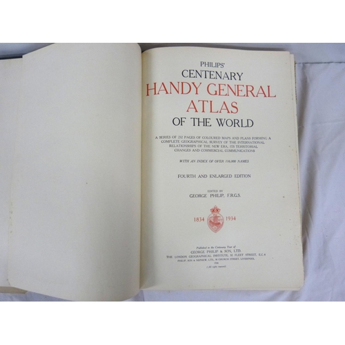 324 - Two large atlases to include new atlas of the world and Phillips handy general atlas 1934.