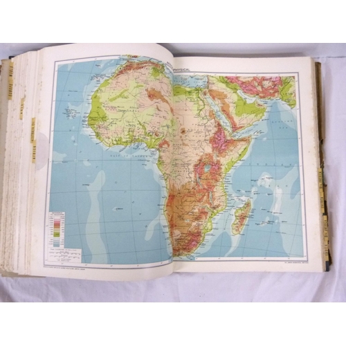 324 - Two large atlases to include new atlas of the world and Phillips handy general atlas 1934.