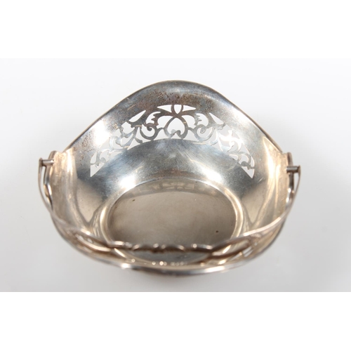 472 - Silver swing handled pierced basket, maker HM, Birmingham, 45g.