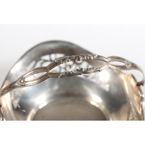 472 - Silver swing handled pierced basket, maker HM, Birmingham, 45g.