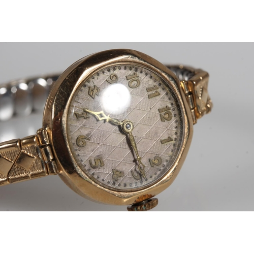 475 - Ladies 9ct yellow gold cased wristwatch.