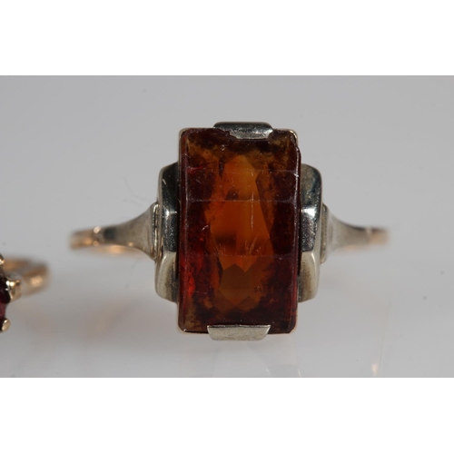 478 - 9ct yellow gold garnet three stone set ring and another, 4.7g.