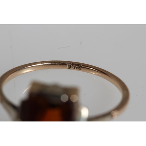 478 - 9ct yellow gold garnet three stone set ring and another, 4.7g.