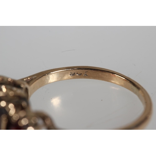 478 - 9ct yellow gold garnet three stone set ring and another, 4.7g.