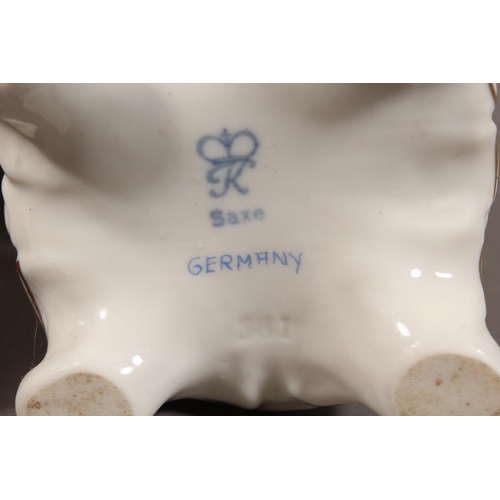 48 - Pair of Saxe of Germany porcelain figures modelled as a gentleman resting on a spade and a female ho... 