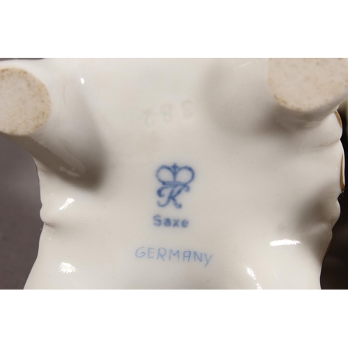 48 - Pair of Saxe of Germany porcelain figures modelled as a gentleman resting on a spade and a female ho... 