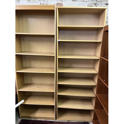 496 - Two laminate open fronted bookcases.