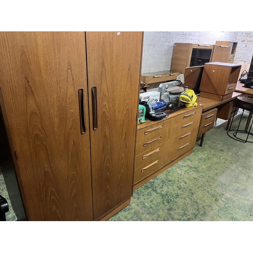 504 - G-Plan four piece tea bedroom suite comprising wardrobe, chest, bedside and mirror backed dressing t... 