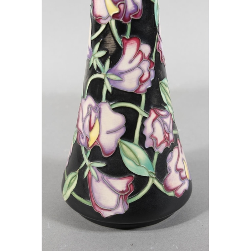 244 - Moorcroft pottery Sweet Pea pattern vase, 31cm tall.